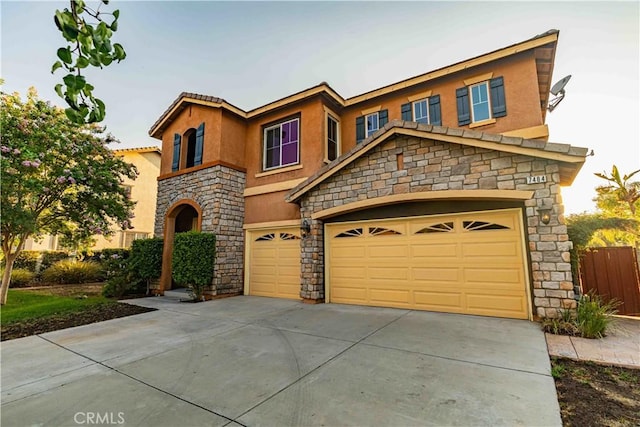 view of front of property featuring a garage, driveway, fence, and stucco siding