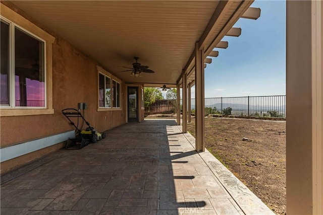 view of patio featuring a ceiling fan and a fenced backyard