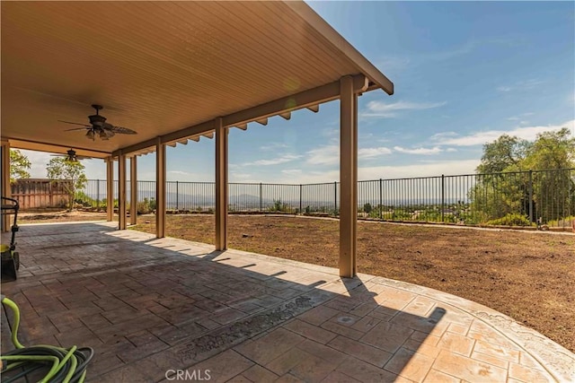 view of patio with a fenced backyard and a ceiling fan