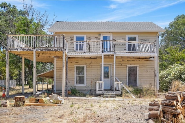 back of house with a wooden deck