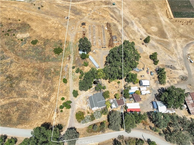 birds eye view of property with a rural view