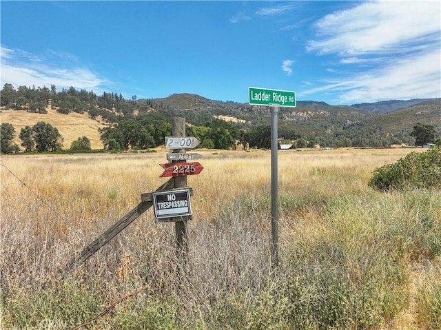 mountain view featuring a rural view