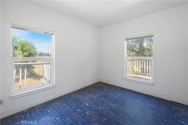 spare room featuring dark hardwood / wood-style flooring