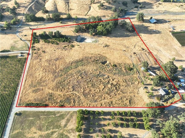 birds eye view of property with a rural view