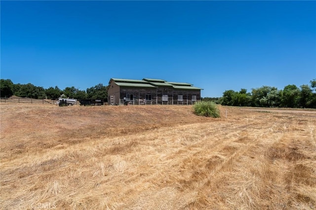 exterior space with a rural view