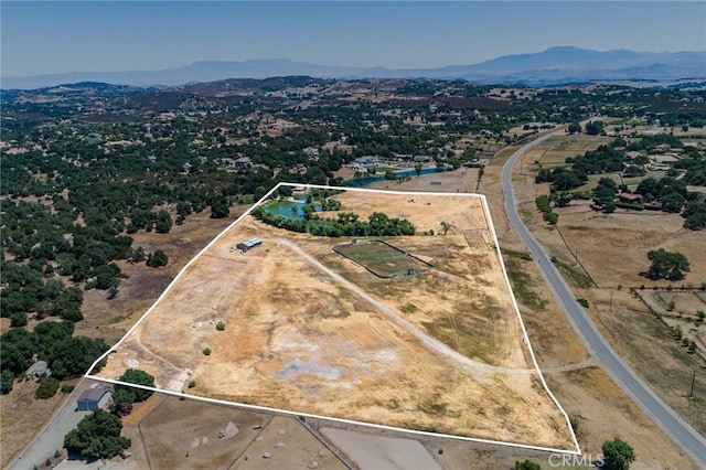 birds eye view of property with a mountain view