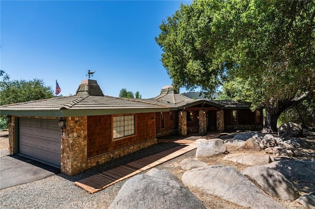 ranch-style house featuring a garage