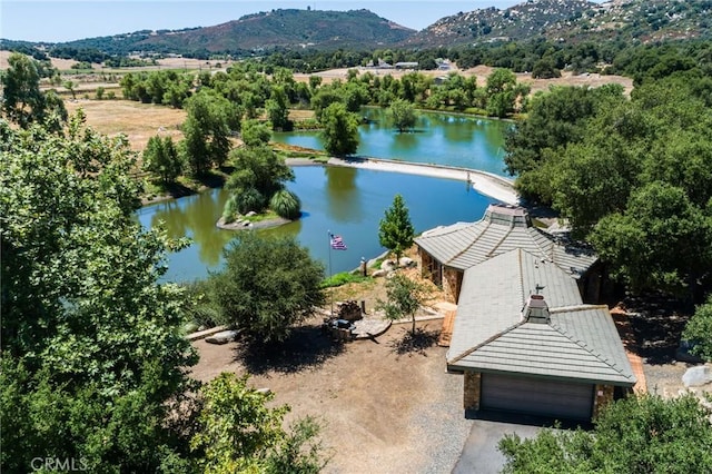 aerial view featuring a water and mountain view