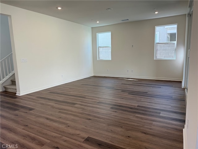 4811 Swallowtail Ln, Fontana, CA 92336 - spare room with dark wood finished floors, stairway, recessed lighting, and baseboards