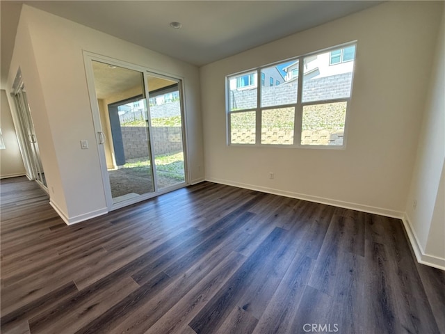 4811 Swallowtail Ln, Fontana, CA 92336 - empty room with dark wood-style flooring and baseboards