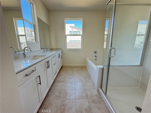 4811 Swallowtail Ln, Fontana, CA 92336 - bathroom with double vanity, a bath, a stall shower, and baseboards