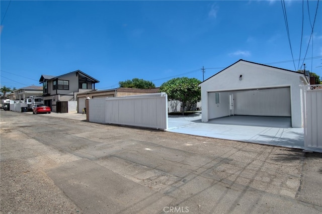 exterior space featuring an outbuilding and a garage