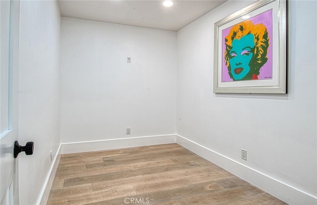 unfurnished room featuring hardwood / wood-style floors