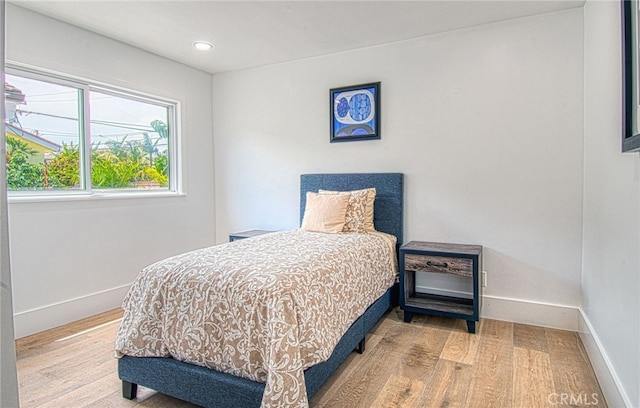 bedroom featuring light wood-type flooring