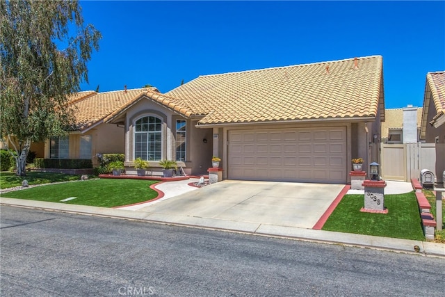 mediterranean / spanish house featuring a garage