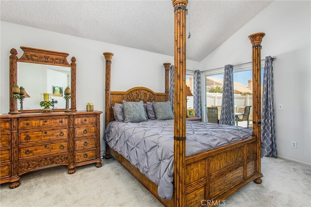 carpeted bedroom featuring access to outside, a textured ceiling, and lofted ceiling