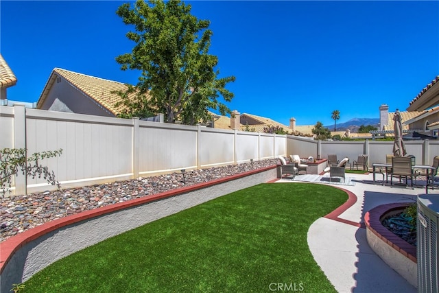 view of yard featuring a patio and an outdoor living space