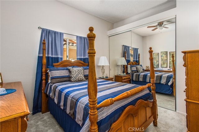 bedroom with light carpet, a closet, and ceiling fan