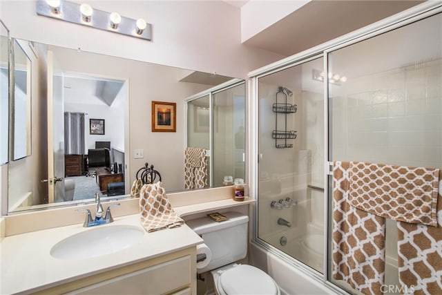 full bathroom featuring vanity, toilet, and bath / shower combo with glass door