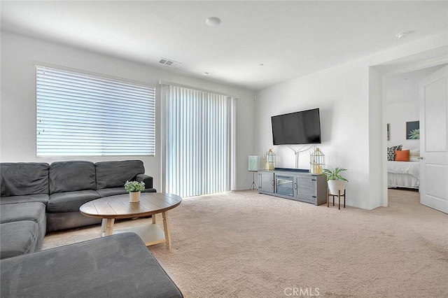 living room with light colored carpet