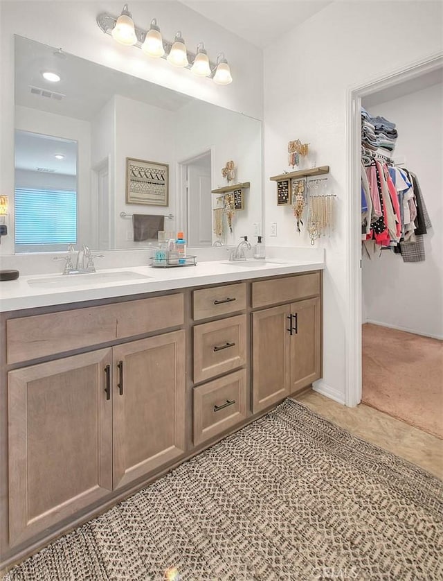 bathroom featuring tile patterned floors and vanity