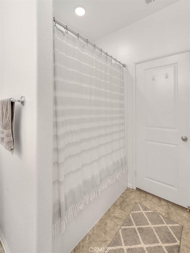 bathroom featuring curtained shower