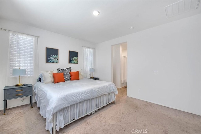 bedroom with light colored carpet