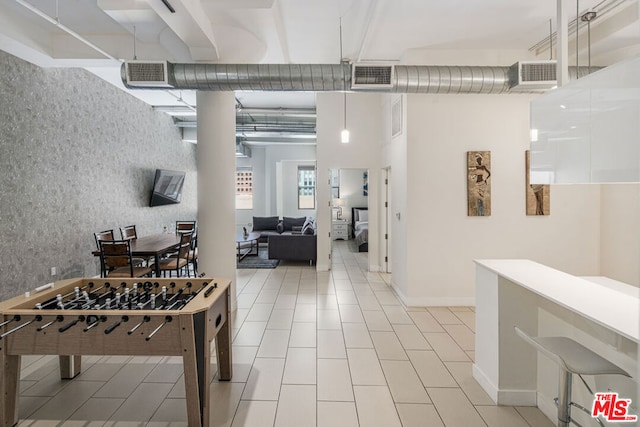 rec room featuring light tile patterned flooring