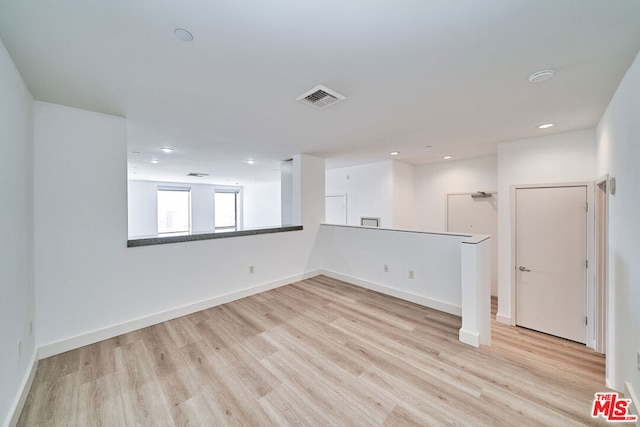 empty room with light hardwood / wood-style floors