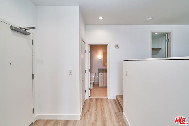 corridor featuring light tile patterned floors