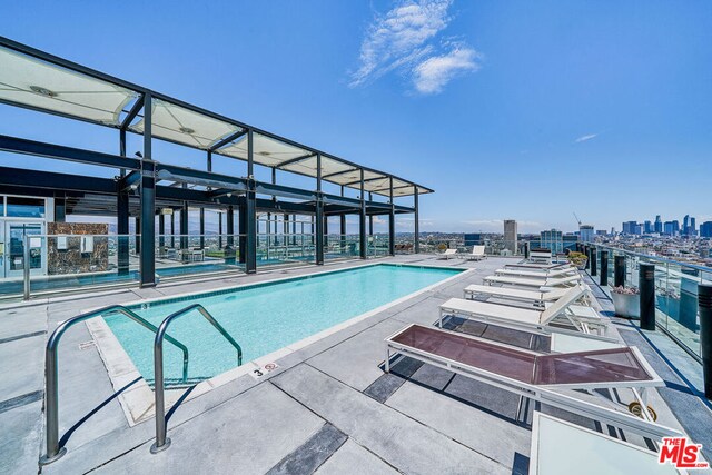 view of swimming pool featuring a patio