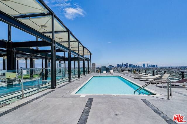 view of swimming pool featuring a patio