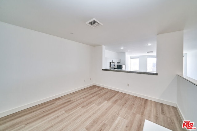 empty room with light wood-type flooring