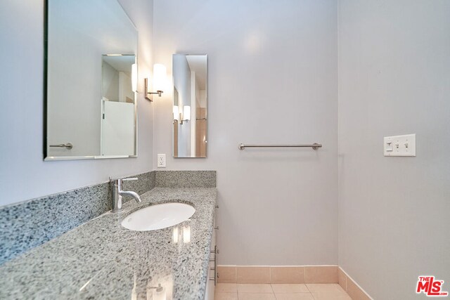 bathroom featuring tile patterned floors and vanity