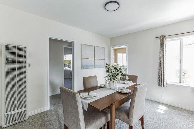 dining space featuring carpet flooring