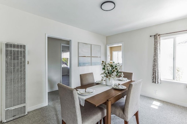 dining room with dark carpet