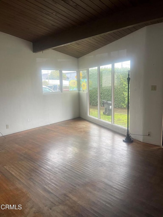 unfurnished room featuring wood ceiling, a wealth of natural light, lofted ceiling with beams, and wood-type flooring