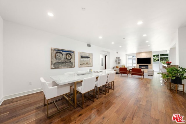 dining area featuring dark hardwood / wood-style flooring