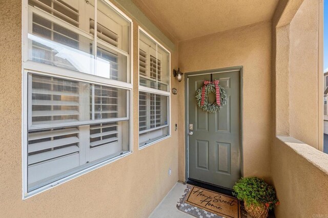 doorway to property with a porch