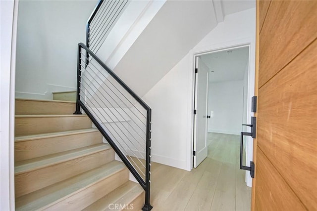 stairway featuring hardwood / wood-style flooring