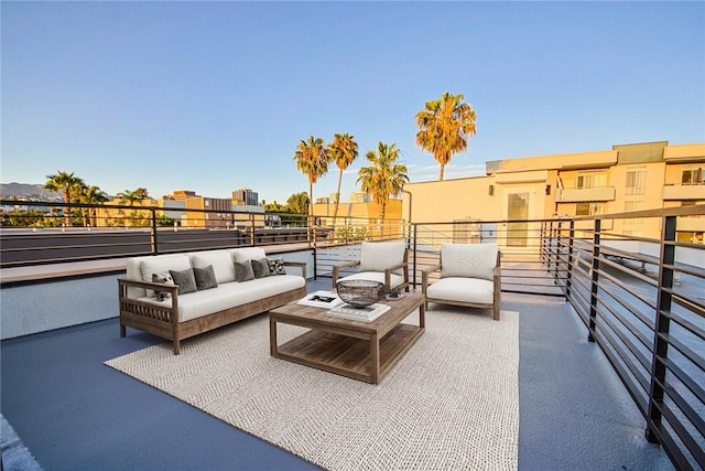 view of patio featuring a balcony and outdoor lounge area