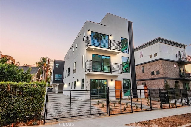 view of front of home featuring a balcony