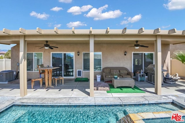 rear view of property featuring a patio area, ceiling fan, and central AC unit