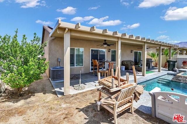 back of house with central AC, ceiling fan, and a patio