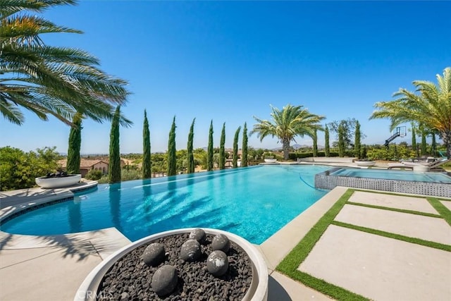 view of swimming pool featuring a patio