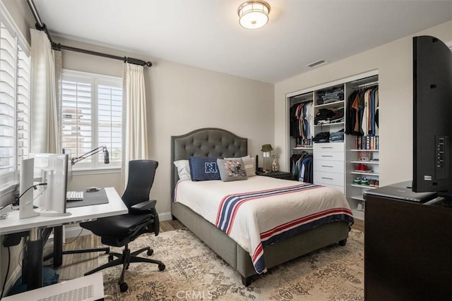 bedroom featuring a closet and hardwood / wood-style flooring