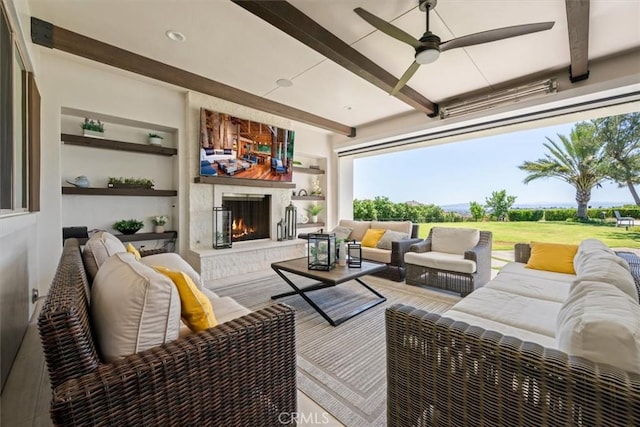 wooden terrace featuring an outdoor living space with a fireplace and ceiling fan