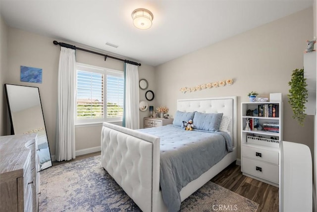 bedroom featuring dark wood-type flooring