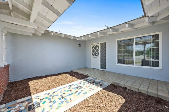 entrance to property with a patio area