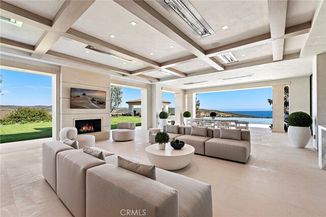 tiled living room featuring beam ceiling, a fireplace, and coffered ceiling